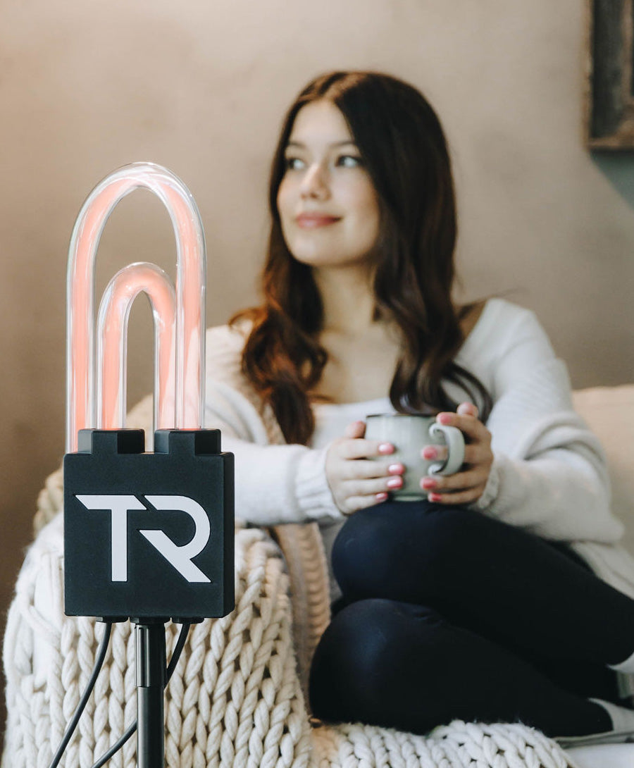 Woman relaxing on a couch during a SuperNova session