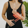 A woman putting her wrist inside the TrueRife Vortex Bulb