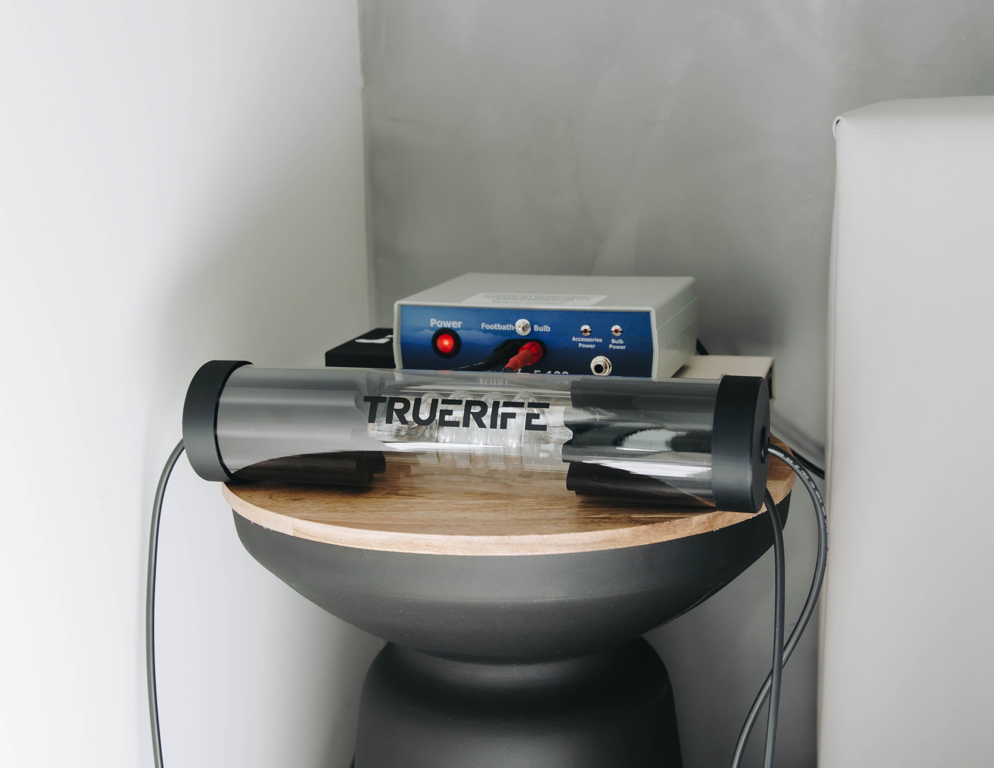 TrueRife F-122 Generator and Overnight Tornado Bulb on a bedside table