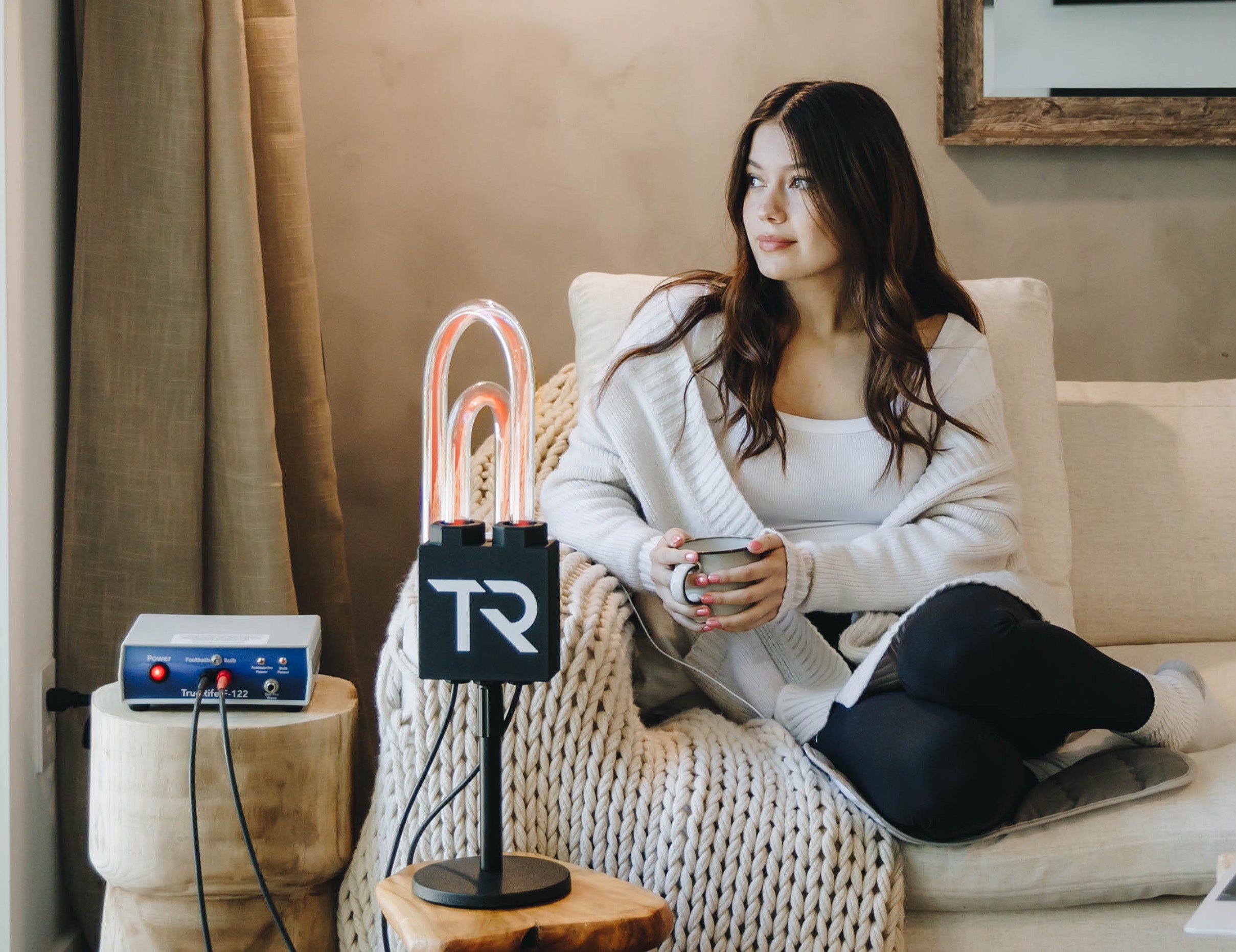 Woman relaxing on a couch during a SuperNova session