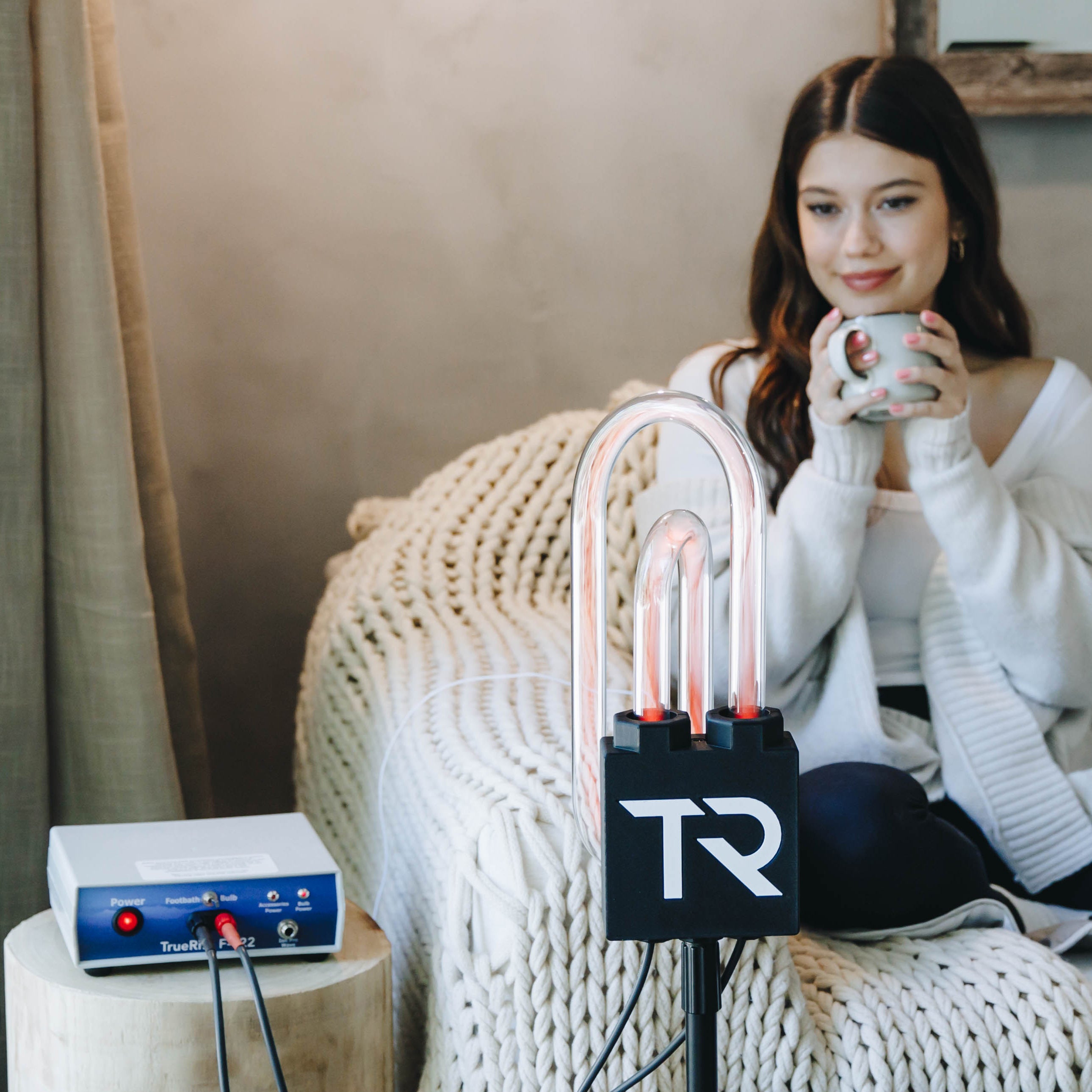 Woman relaxing on a couch during a SuperNova session