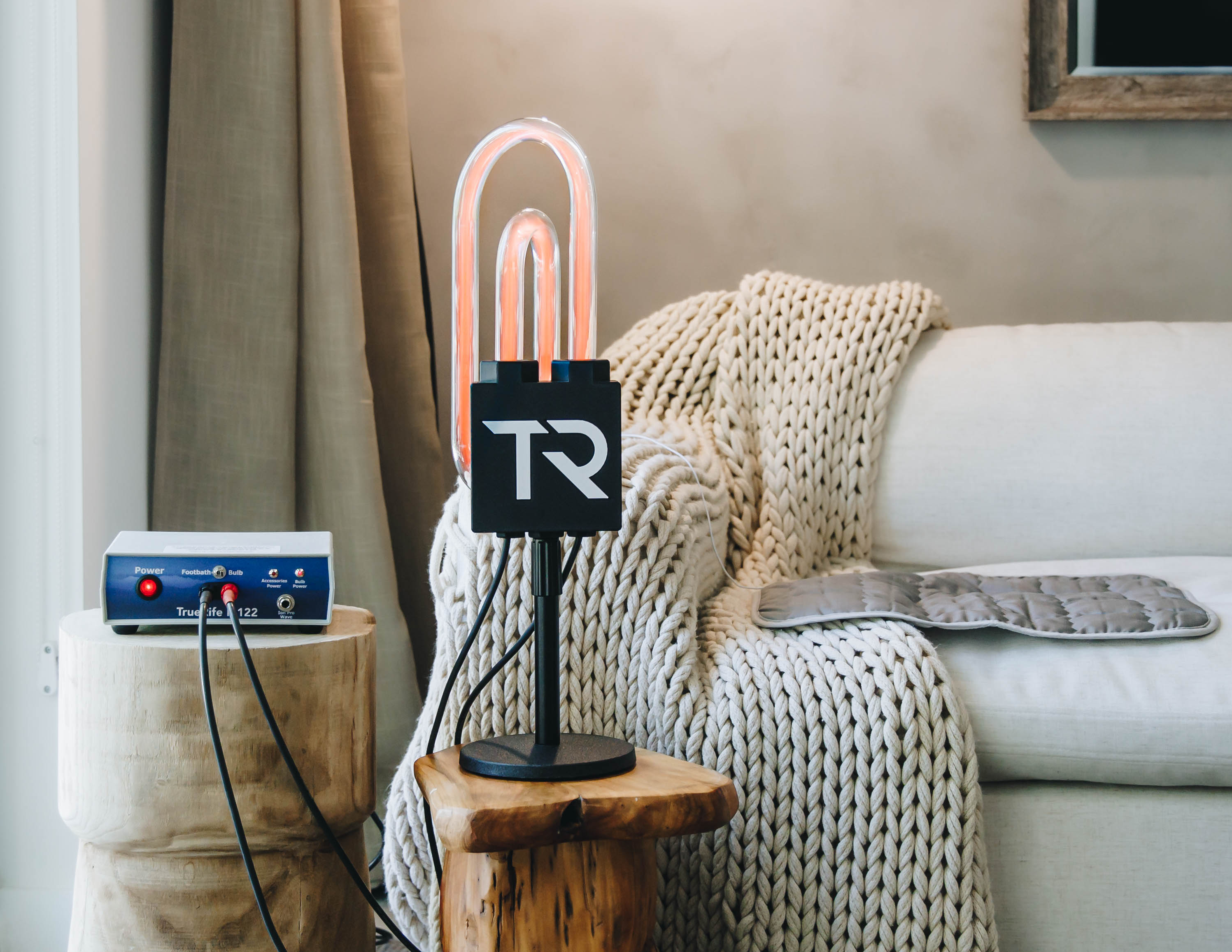 TrueRife SuperNova Bulb beside a couch with the F-122 generator