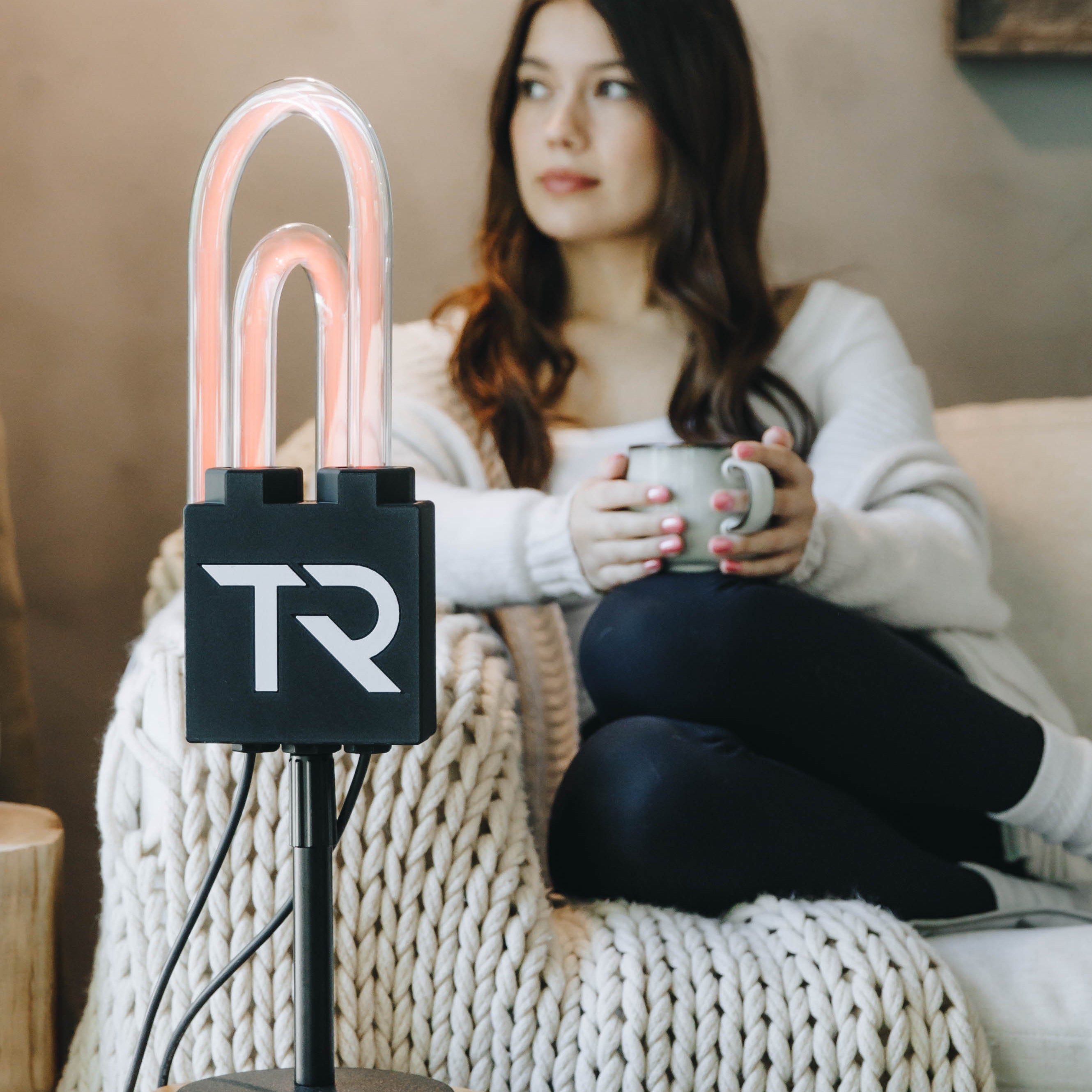 Woman relaxing on a couch during a SuperNova session