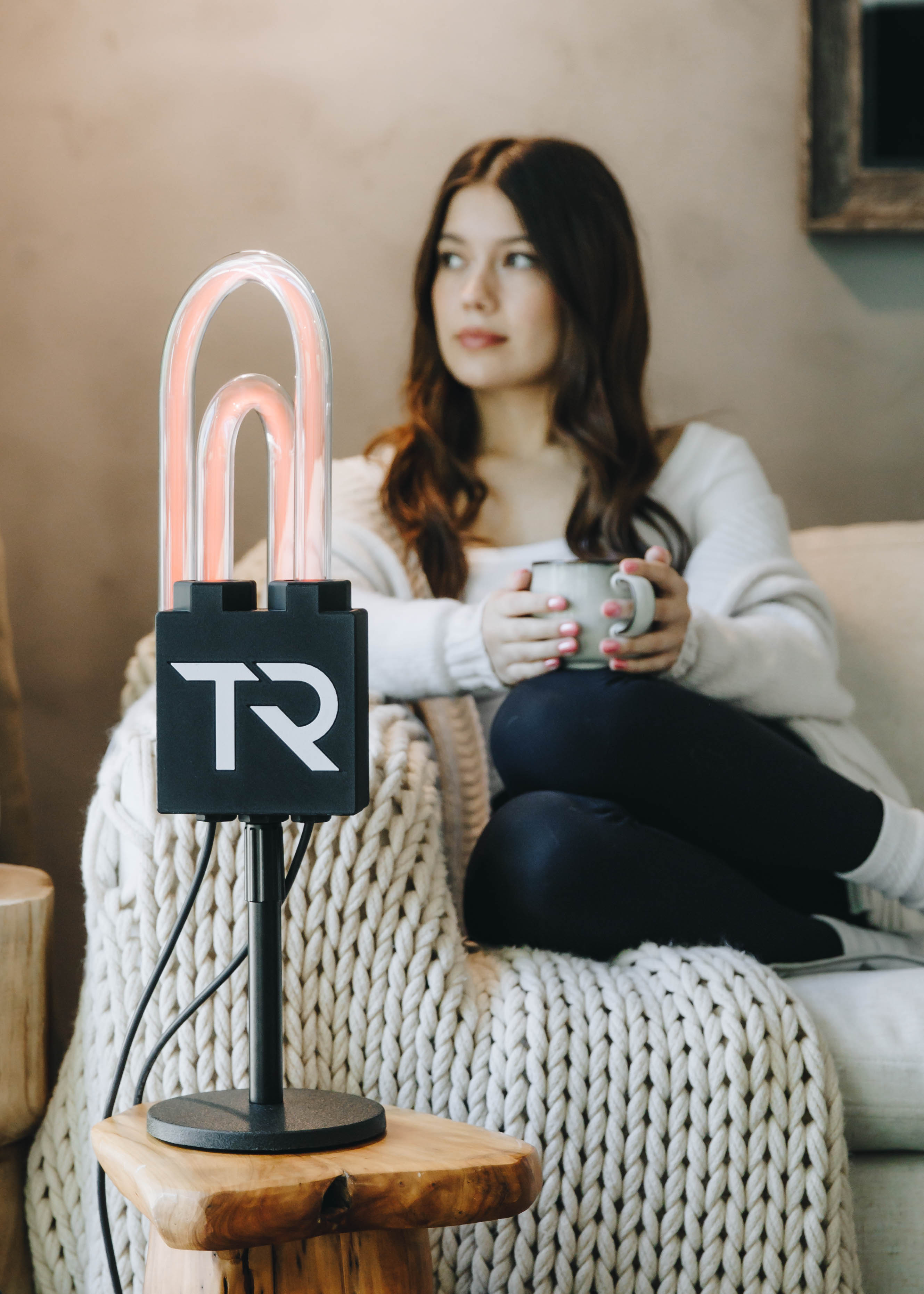 Woman relaxing on a couch during a SuperNova session