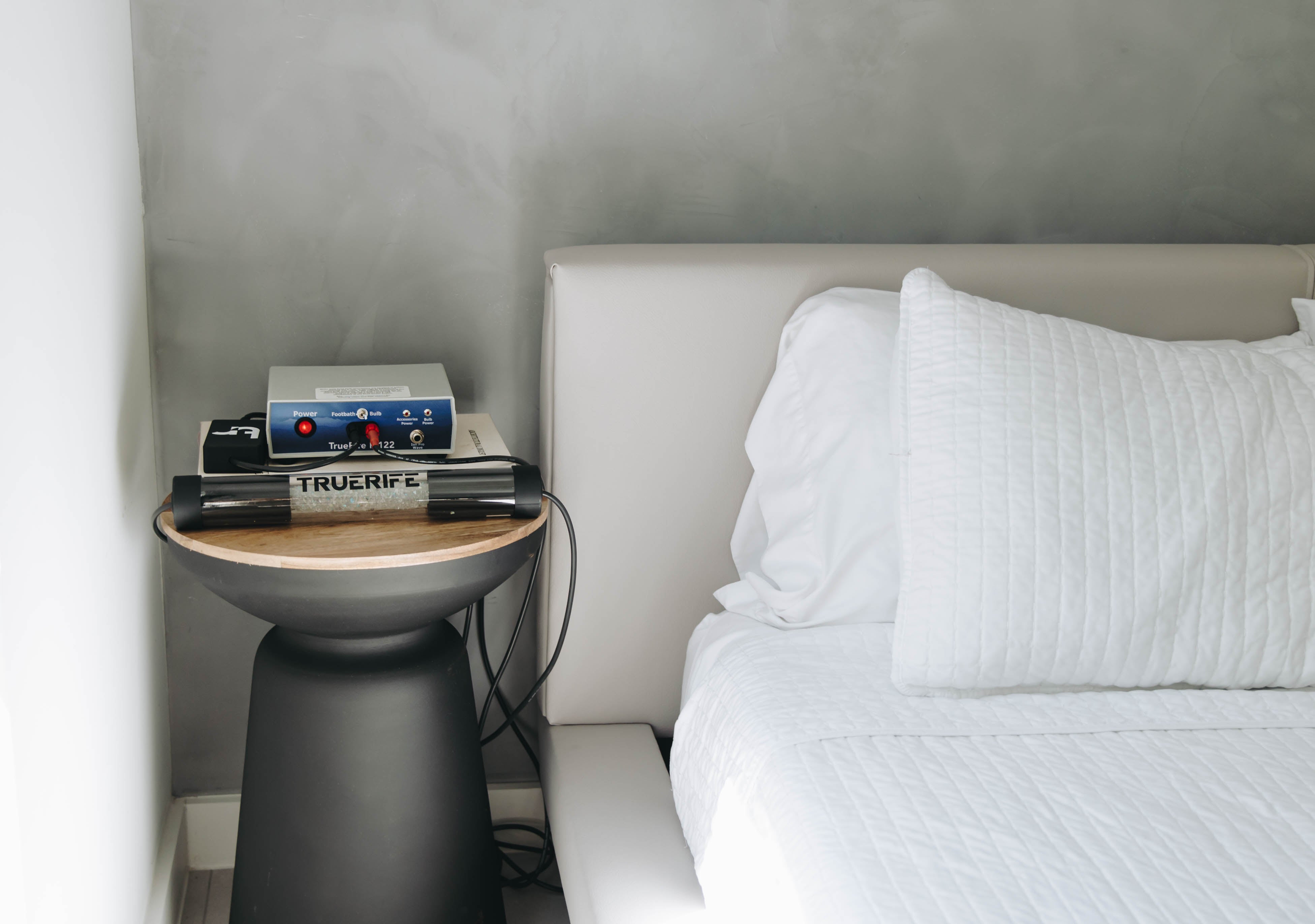 Crystal Hammer on a bedside table connected to the TrueRife F-122 Generator