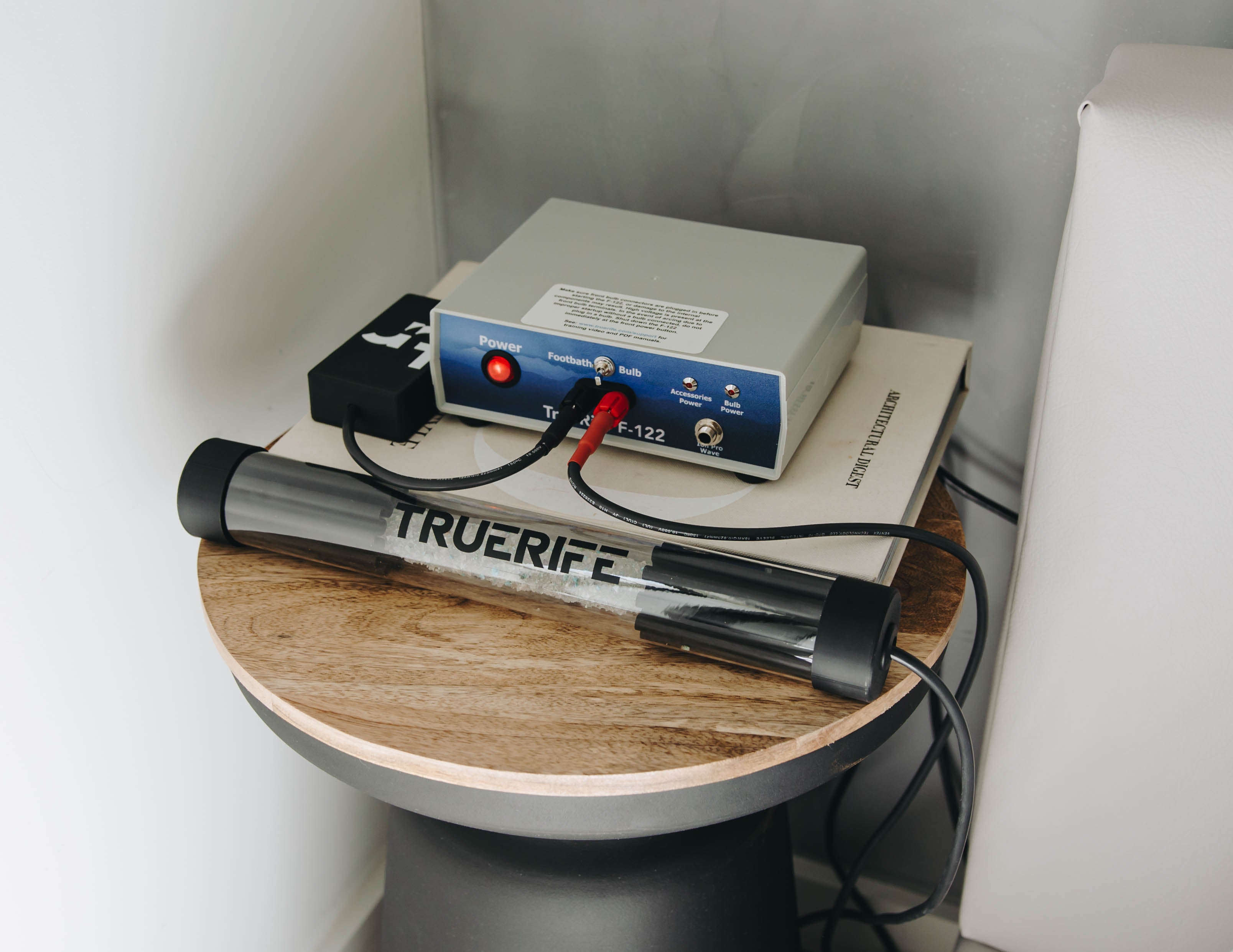 Crystal Hammer on a bedside table connected to the TrueRife F-122 Generator